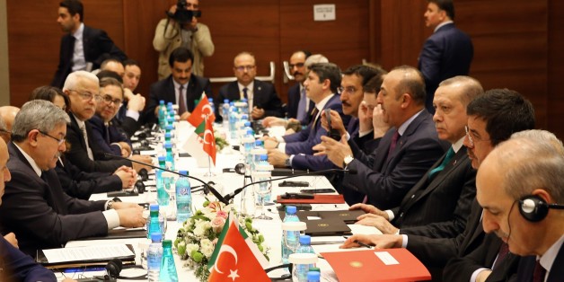 ALGIERS, ALGERIA - FEBRUARY 26: President of Turkey Recep Tayyip Erdogan (R) accompanied by Turkish Foreign Minister Mevlut Cavusoglu (right 4), Turkish Economy Minister Nihat Zeybekci (right 2), Turkey's Customs and Trade Minister Bulent Tufenkci (right 6) and Turkey's Energy and Natural Resources Minister Berat Albayrak (right 5) meets Prime Minister of Algeria Ahmed Ouyahia (L) in Algiers, Algeria on February 26, 2018. (Photo by Halil Sagirkaya/Anadolu Agency/Getty Images)