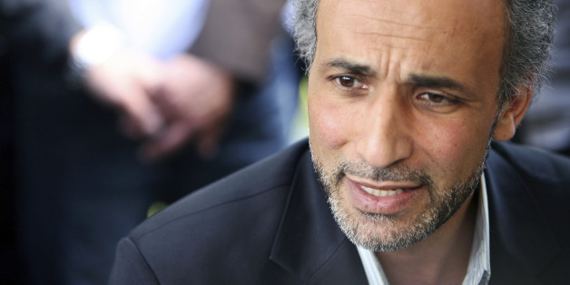 Author Tariq Ramadan talks with a journalist after a conference at the Er-Rahma mosque in Nantes, western France, April 25, 2010. Ramadan, a Swiss citizen of Egyptian origin who was born in Switzerland, has written extensively on Western Muslims and on Islam. He is president of the thinktank European Muslim Network in Brussels and teaches at Britain's Oxford University. REUTERS/Stephane Mahe (FRANCE - Tags: RELIGION PROFILE)