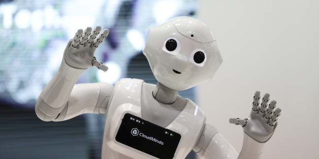 A SoftBank Group Corp. Pepper humanoid robot stands on display during day two of the Mobile World Congress (MWC) in Barcelona, Spain, on Tuesday, Feb. 27, 2018. At the wireless industry's biggest conference, more than 100,000 people are set to see the latest smartphones, artificial intelligence devices and autonomous drones exhibited by roughly 2,300 companies. Photographer: Simon Dawson/Bloomberg via Getty Images