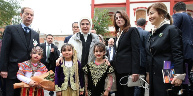 ALGIERS, ALGERIA - FEBRUARY 27: (----EDITORIAL USE ONLY MANDATORY CREDIT - 'TURKISH PRESIDENCY / MURAT CETINMUHURDAR / HANDOUT' - NO MARKETING NO ADVERTISING CAMPAIGNS - DISTRIBUTED AS A SERVICE TO CLIENTS----) President of Turkey Recep Tayyip Erdogan's wife Emine Erdogan (C) poses for a photo with kids during an opening ceremony of a preschool and a park belonging to FOREM Foundation, that were renovated by Turkish Cooperation and Coordination Agency (TIKA) and named after Emine Erdogan, in Alg