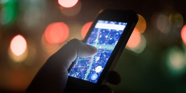 female hand holding smart-phone for order something from web market with bokeh lighting background