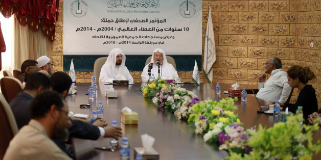 Chairman of the International Union of Muslim Scholars Youssef al-Qaradawi (3rd R) speaks during a news conference in Doha June 23, 2014. The influential Sunni Muslim cleric said on Monday that only dialogue could solve Iraq's crisis, sounding a conciliatory note on the threat posed by Sunni Islamist insurgents that could further polarise the Middle East along sectarian lines. Picture taken June 23. REUTERS/Mohammed Dabbous (QATAR - Tags: RELIGION POLITICS CIVIL UNREST)