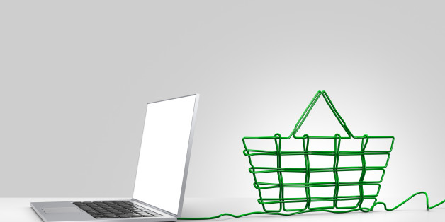 Laptop computer with green ethernet cable forming a shopping basket, coming out of the back on a plain background