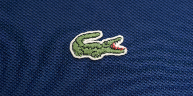 'Massa, italy - September 24, 2011: Lacoste Tennis Shirt and Logo. Lacoste is a French company that produce and sells high-end clothing, footwear, leather goods, watches, eyewear, perfume, and most famously tennis shirts.'