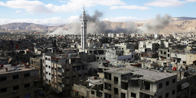 Smoke rises from the besieged Eastern Ghouta in Damascus, Syria, February 27, 2018. REUTERS/ Bassam Khabieh