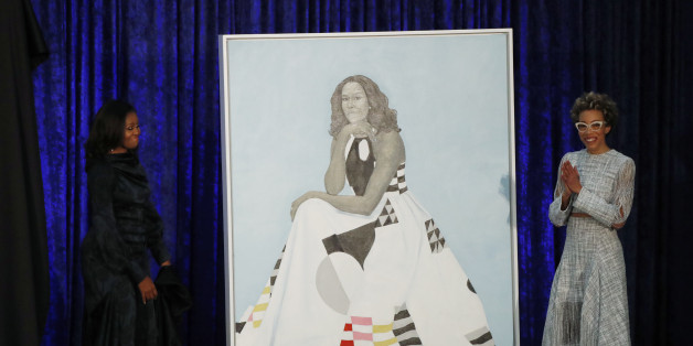 Artist Amy Sherald (R) and former first lady Michelle Obama participate in the unveiling of Mrs. Obama's portrait at the Smithsonianâs National Portrait Gallery in Washington, U.S., February 12, 2018. REUTERS/Jim Bourg