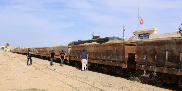 Protesters are seen near a train station during a blockade of phosphate transported by rail from the Redayef mine, in Redayef, Tunisia October 16, 2016. Picture taken October 16, 2016. To match Insight TUNISIA-POLITICS/ REUTERS/Zoubeir Souissi