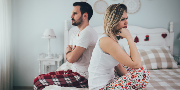 Couple having arguments and sexual problems in bed