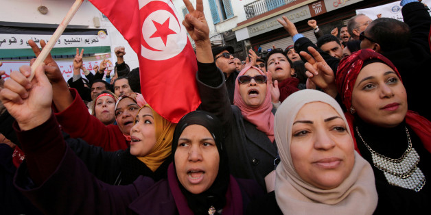 Women shout slogans during demonstrations on the seventh anniversary of the toppling of president Zine El-Abidine Ben Ali, in Tunis, Tunisia January 14, 2018. REUTERS/Youssef Boudlal