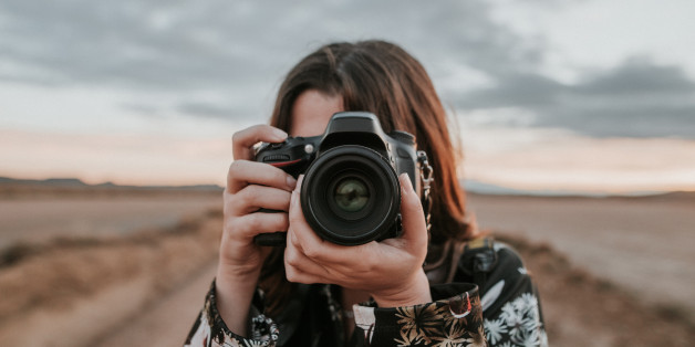 Young woman taking a picture