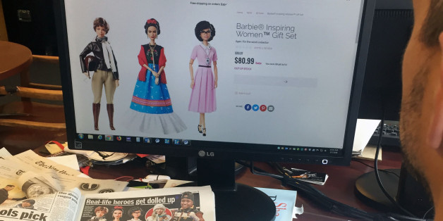 A journalist looks at the new series Barbie 'Inspiring Women', featuring (L-R) Amelia Earhart, Frida Kahlo and Katherine Johnson that honors three historic figures who each made a major mark on the world on March 7, 2018 in New York.Mexican artist Frida Kahlo, French chef Hélène Darroze or snowboarder Chloe Kim now have their Barbie, as well as a series of other famous women, unveiled March 7, 2018 by Mattel, who is trying a new marketing move to address the slowdown in sales. This week Ma