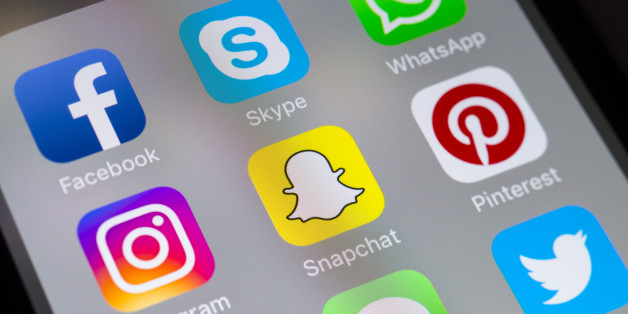 London, UK - November 11 2016: The buttons of Skype, Instagram, Messages, Snapchat, Whatsapp, Pintrest, Facebook and Twitter social media apps on the screen of a mobile phone