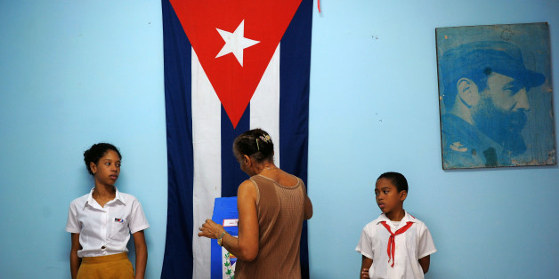 A voter casts her ballot at a polling station in Havana Vieja neighbourhood in Havana, on November 26, 2017, during municipal elections.Cubans vote this Sunday in the first round of municipal elections that will mark a turning point in Cuban history. The polls will kick off a series of elections ending in February 2018 with the first top government generational change in 60 years -- the election of Raul Castro's replacement, who will, for the first time, be a post-revolutionary figure. / AFP PHO