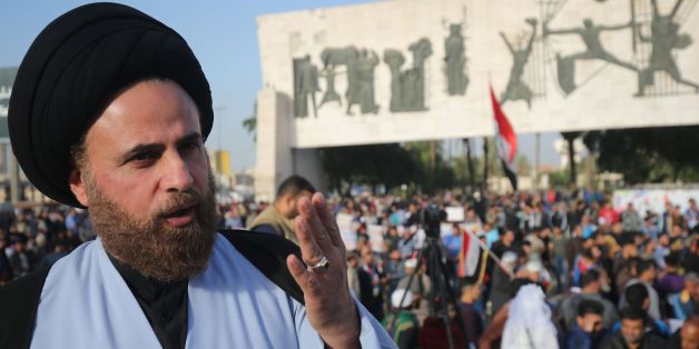 Ibrahim al-Jabiri, one of the leaders of Iraq's Shiite Sadr Movement, gives an interview during a demonstration by the movement in the capital Baghdad's Tahrir square against corruption in the Iraqi government on March 2, 2018.Followers of a black-turbaned Shiite cleric are seeing red ahead of Iraq's May elections, allying with the once-powerful communist party for the first time in the country's history. / AFP PHOTO / AHMAD AL-RUBAYE (Photo credit should read AHMAD AL-RUBAYE/AFP/Getty Im