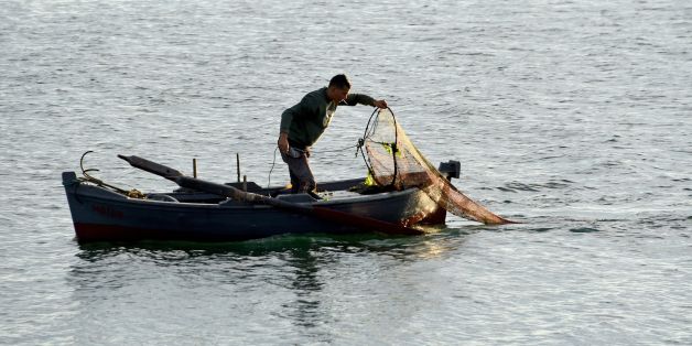 A Tunisian fisherman fishes off the harbour town of Menzel Abderrahmen on the Lake of Bizerte on November 1, 2016.The European Union launched a depollution project of the Lake Bizerte to reduce indirect pollution impacting the Mediterranean Sea. / AFP / FETHI BELAID (Photo credit should read FETHI BELAID/AFP/Getty Images)