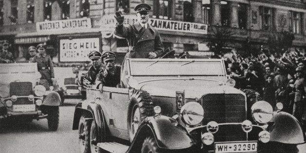 Austrians welcoming Adolf Hitler's arrival into Vienna, Anschluss, Austria, from L'Illustrazione Italiana, Year LXV, No 12, March 20, 1938.