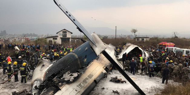 Wreckage of an airplane is pictured as rescue workers operate at Kathmandu airport, Nepal March 12, 2018. REUTERS/ Navesh Chitrakar