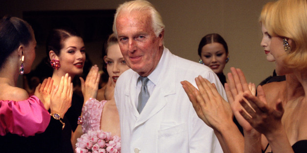 French fashion designer Hubert de Givenchy is applauded by the models after he presented his last High Fashion collection Autumn/Winter 1995 in Paris July 11. Givenchy will be retiring at the end of the year