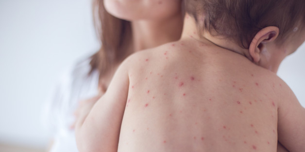 Mother nursing sick child At Home