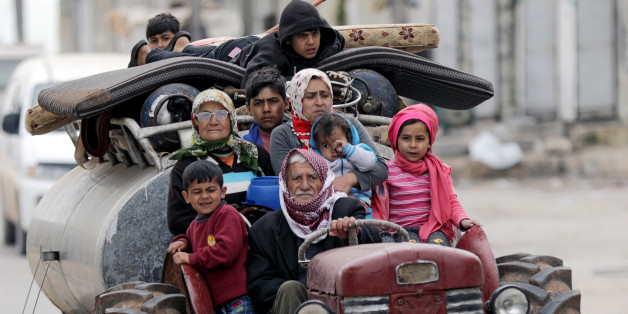 People flee after Turkish-backed Free Syrian Army fighters captured Khaldieh village in eastern Afrin, Syria March 10, 2018.REUTERS/ Khalil Ashawi TPX IMAGES OF THE DAY