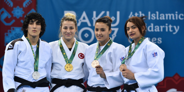 (From L) Azerbaijan's Khanim Huseynova (silver), Turkey's Busra Katipoglu (gold), Algeria's Amina Belkadi (bronze) and Tunisia's Mariem Bjaoui (bronze) attend the Baku 2017 4th Islamic Solidarity Games Women's Judo -63 kilos podium ceremony at the Heydar Aliyev Arena in Baku, on May 13, 2017.AFP PHOTO / GLYN KIRK/Baku 2017/AFP-Services (Photo credit should read GLYN KIRK/AFP/Getty Images)