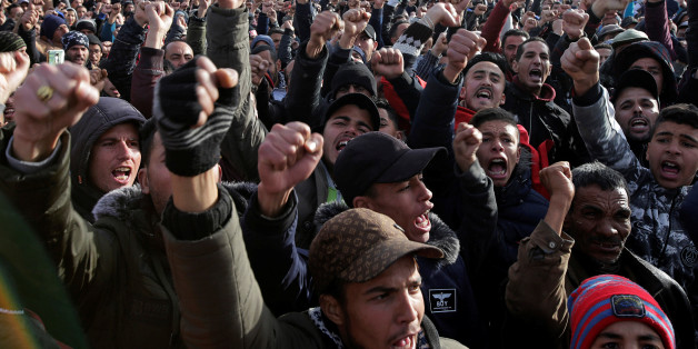 People shout slogans during a protest after the death of a miner who died while working in a clandestine coal mine in Jerada, Morocco February 3, 2018. REUTERS/Youssef Boudlal