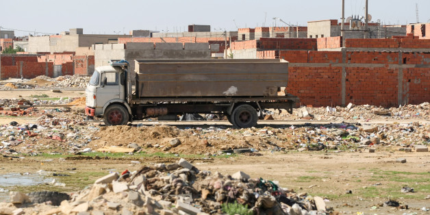 Kairouan,Tunisia - September 16, 2012 : Truck on a construction site full of garbage in Kairouan, Tunisia.